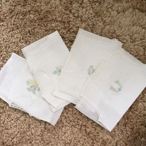 Set of four baby embroidered camisoles.